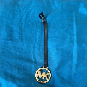 Michael Kors Black Strap with Gold Emblem tag